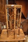 A bamboo plant stand, height approx. 76cm