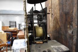 An 18th Century and later stained frame longcase clock having arch top pillar hood, containing 8 day