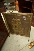 A brass firescreen with galleon design