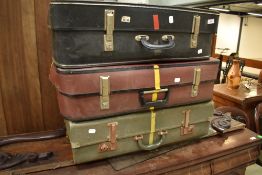 Three vintage suitcases, not leather