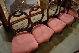 A set of five Victorian mahogany balloon back salon chairs