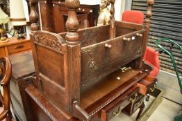 A period oak rocking cradle cot, bears carved monogram and date to end WEG, 1728, length approx.