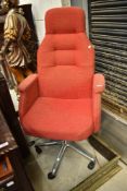 A vintage office chair on chrome base