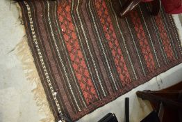 A traditional fireside rug, approx. 140 x 80cm