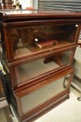 An early 20th Century mahogany stacking bookcase unit , having three glazed tiers, unlabelled but in