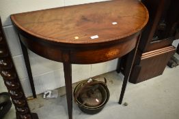 A 19th Century Sheraton style mahogany and inlaid fold over games table, width approx. 87cm