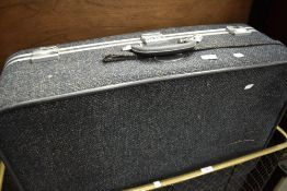 A pair of Skyway tweed lined suitcases