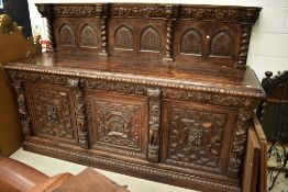 An impressive 19th Century oak sideboard of large proportions with mythical animalistic and