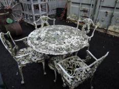 A vintage cast garden table and chair set