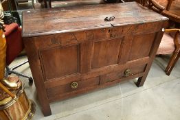 A period oak kist/coffer having three panels to front and two to each side, bearing date 1729, and