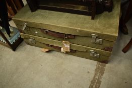 A pair of vintage canvas covered travel cases