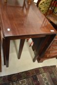 A 19th Century mahogany gateleg table having square tapered legs