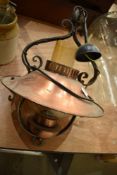 A copper ceiling light fitting