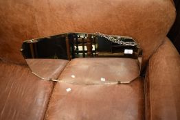 A vintage frameless wall mirror, width approx. 66cm