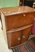 A mid 20th Century walnut cased cocktail cabinet of small proportions, width approx. 62cm