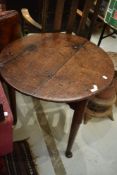 A 19th Century oak cricket table having circular top and triple legs with pad feet, diameter approx.