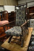 A 19th Century stained frame American style rocking chair
