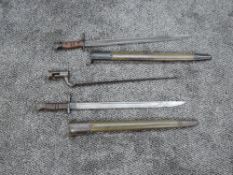 A US 1913 Pattern Bayonet by Winchester stamped 1917 with scabbard, blade length 43cm, overall