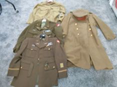 A collection of American Military Clothing including Kharki Great Coat with shoulder patch and