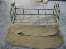 A Bustle Basket for a American Military Jeep, with British army crow foot and dated 1940's on