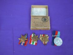 Four WW2 British Medals, 39-45 War Medal, Africa Star, Italy Star and 39-45 Star with ribbons and