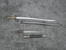 An Italian Sword Bayonet 1891 model with scabbard, blade length 29cm, overall length 39cm and a