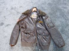 An American Flying Leather Jacket having label for Life Line with eagle cloth badge on sleeve,