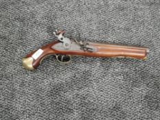 A reproduction Flintlock Pistol marked GR, Crown & Tower