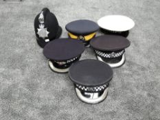 Five Police Caps including Merseyside Police and the Royal Canadian Mounted Police and one