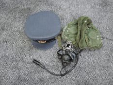 A RAF Cap with RAF Cloth badges and a Pilots Flying Helmet with face mask