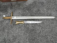 A Eastern Dagger possibly Jambiya having brass handle, blade length 25cm overall length 35cm along