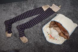 A wonderful pair of early 20th century black stockings with purple and champagne coloured stripes,