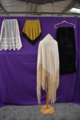 A selection of vintage an antique aprons and shawls,including velvet with blue lining and cream silk