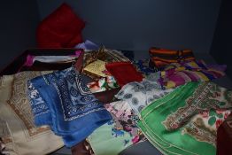 A vibrant selection of vintage scarves including silk.