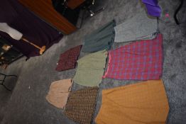 Seven vintage wool/wool blend skirts,various sizes and eras.