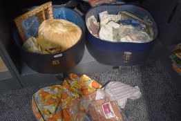 Two vintage hat cases containing a mixture of vintage items, hat, apron, collars, stockings and