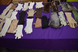 A box of vintage and antique gloves and fur gauntlets,various styles and eras.