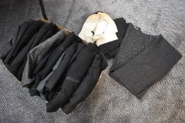 A large collection of vintage and retro waistcoats,various sizes and styles.