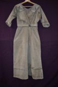 An early 20th century dress having three quarter sleeves and shawl collar,beautiful details