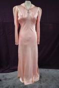 A decadent 1930s full length bias cut art deco negligee or nightdress having quilted detail to