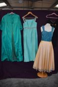 A selection of vintage items including gown with full skirt and hook and eyes to back and emerald