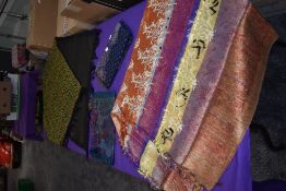 A collection of vintage shawls, various fabrics and eras.
