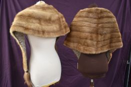 Two vintage blonde mink wraps, one having tails.