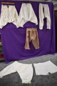 A selection of antique bloomers and under garments including split leg bloomers.
