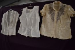 Three vintage 1950s blouses, smaller sizes.