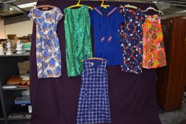 A selection of vintage dresses and a bright skirt, including St Michaels sailor style dress,