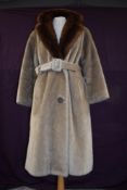 A vintage Astraka of London faux fur camel coloured coat with belted waist and mink collar.