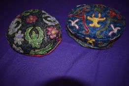 Two caps,around 1930s,having colourful soutache type braiding to both.
