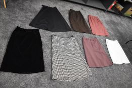 A selection of vintage maxi skirts, various sizes and styles.