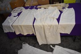 A mixed lot of vintage and antique underwear, aprons and more also included is a Victorian